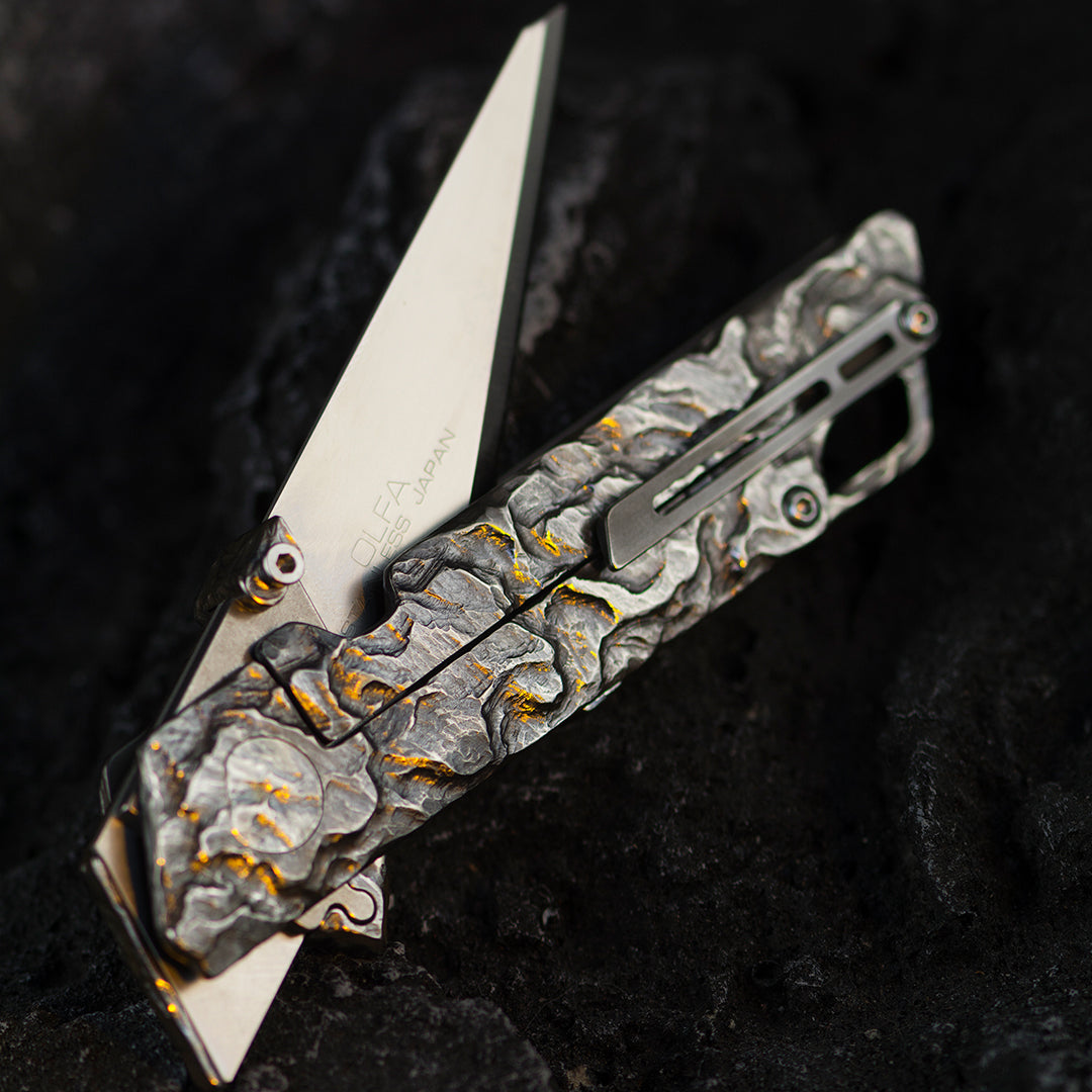 Hand-carved Raven: Titanium Utility Folding knife