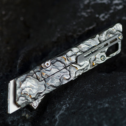 Hand-carved Raven: Titanium Utility Folding knife